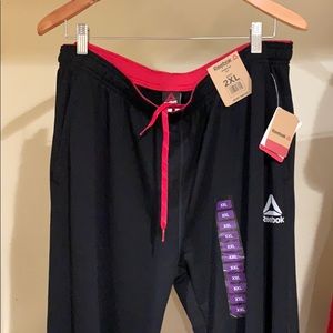 Black straight Reebok sweatpants.